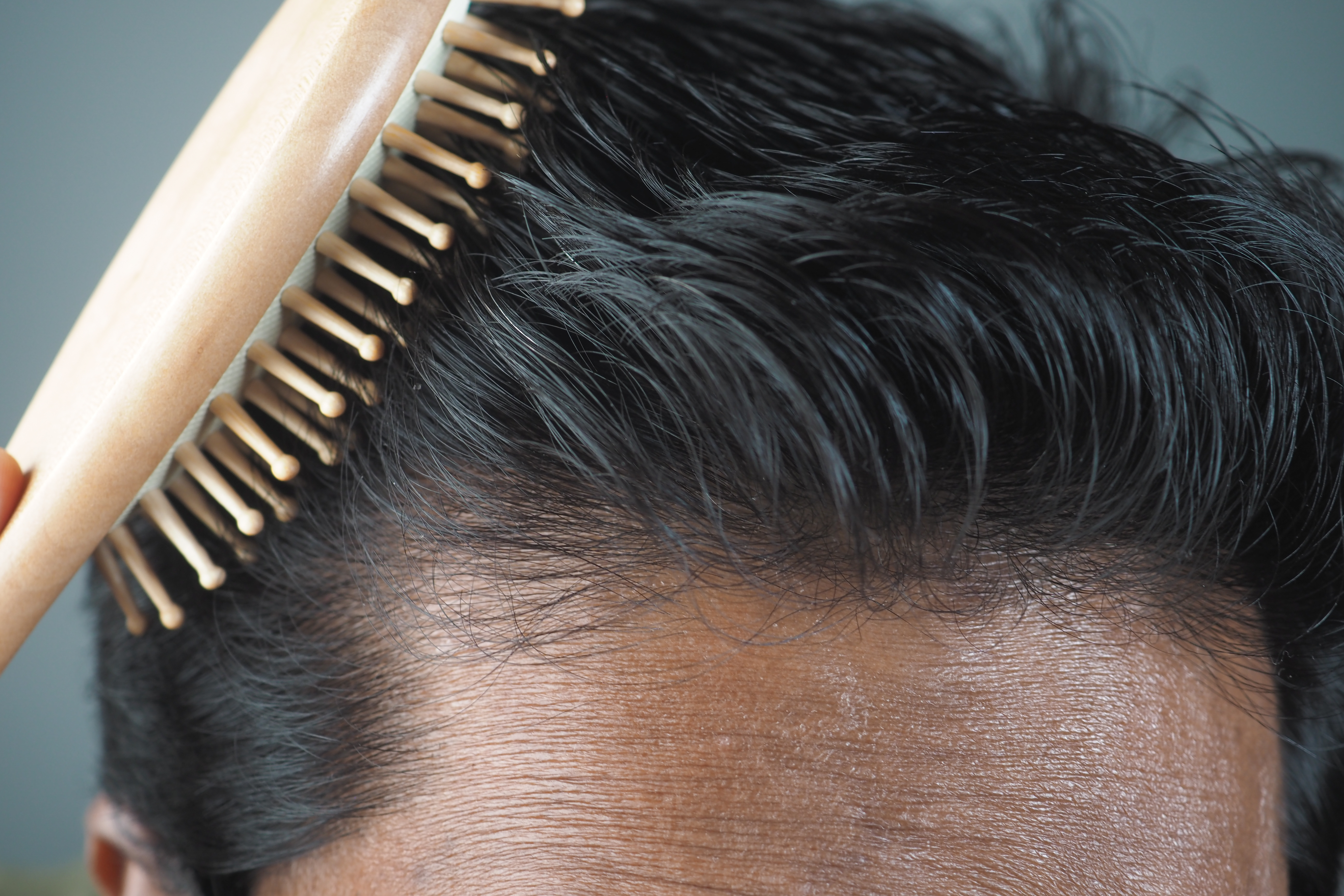 grooming-essentials-a-closeup-of-hair-combing-with-2024-12-13-16-24-17-utc.jpg